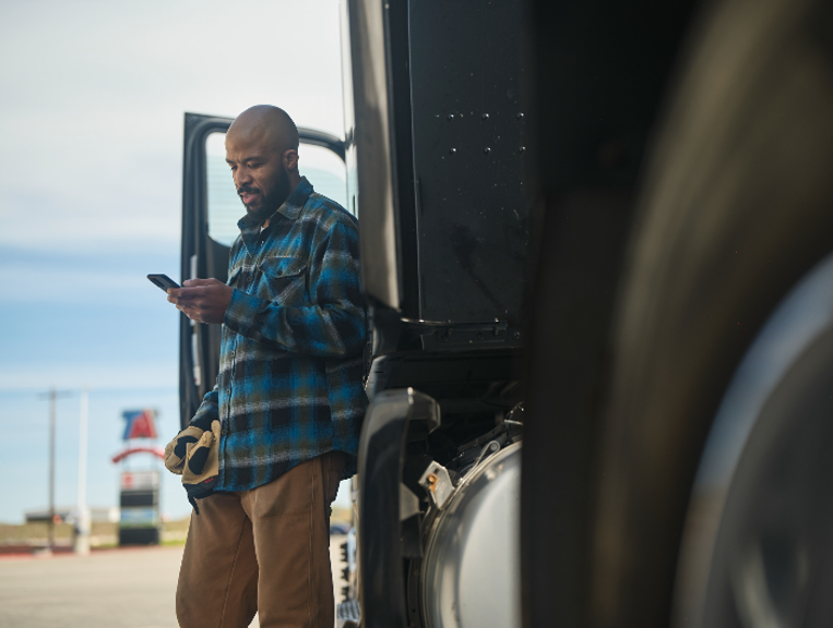 Man Stands Outside Truck