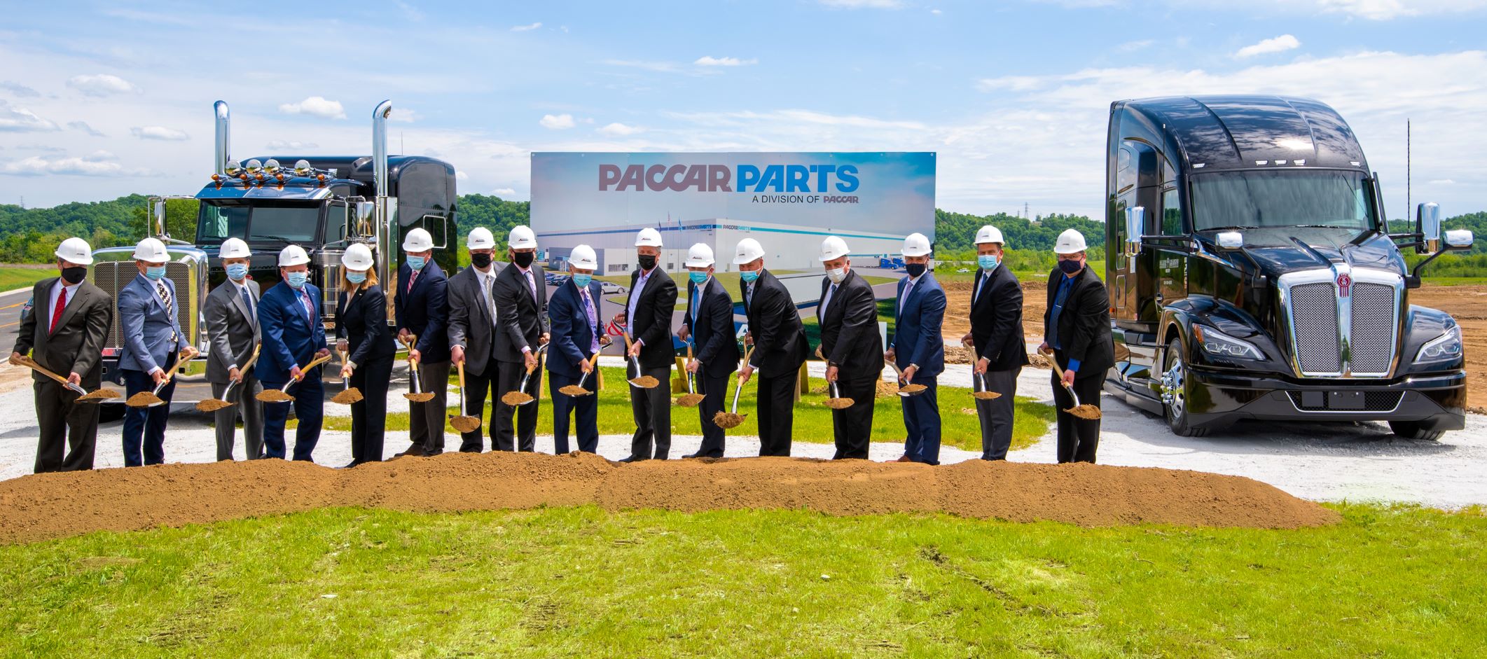 A group of people breaking ground