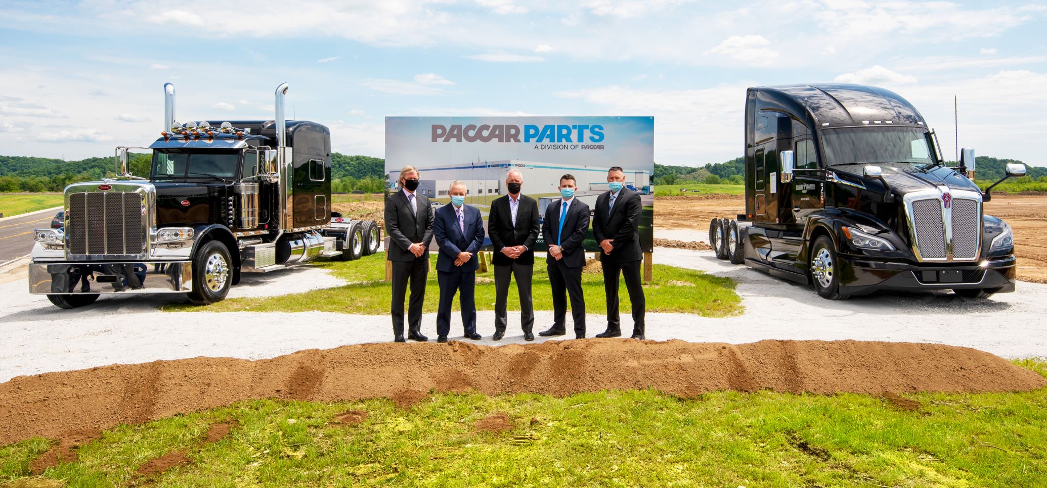 Another group of people breaking ground